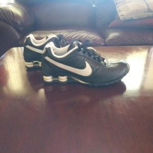 Black and white women's Nike Shox